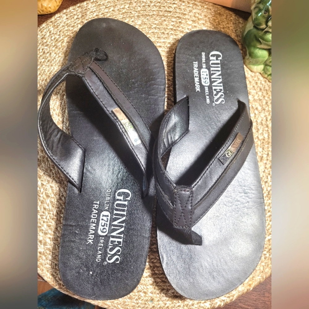 Guinness men's black flip-flops. Size 9. Used.